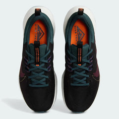 Top-down view of a pair of Nike Juniper Trail 2 Women's trail shoes in black, maroon, and green, highlighting their durable construction and lace-up closure.
