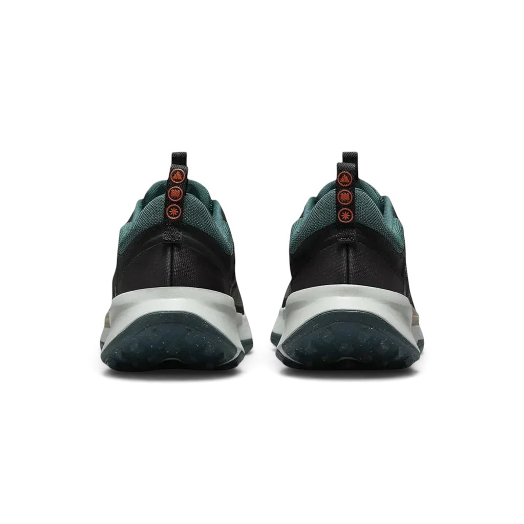 Rear view of the Nike Juniper Trail 2 Women's trail shoes, focusing on the structured heel and subtle branding.