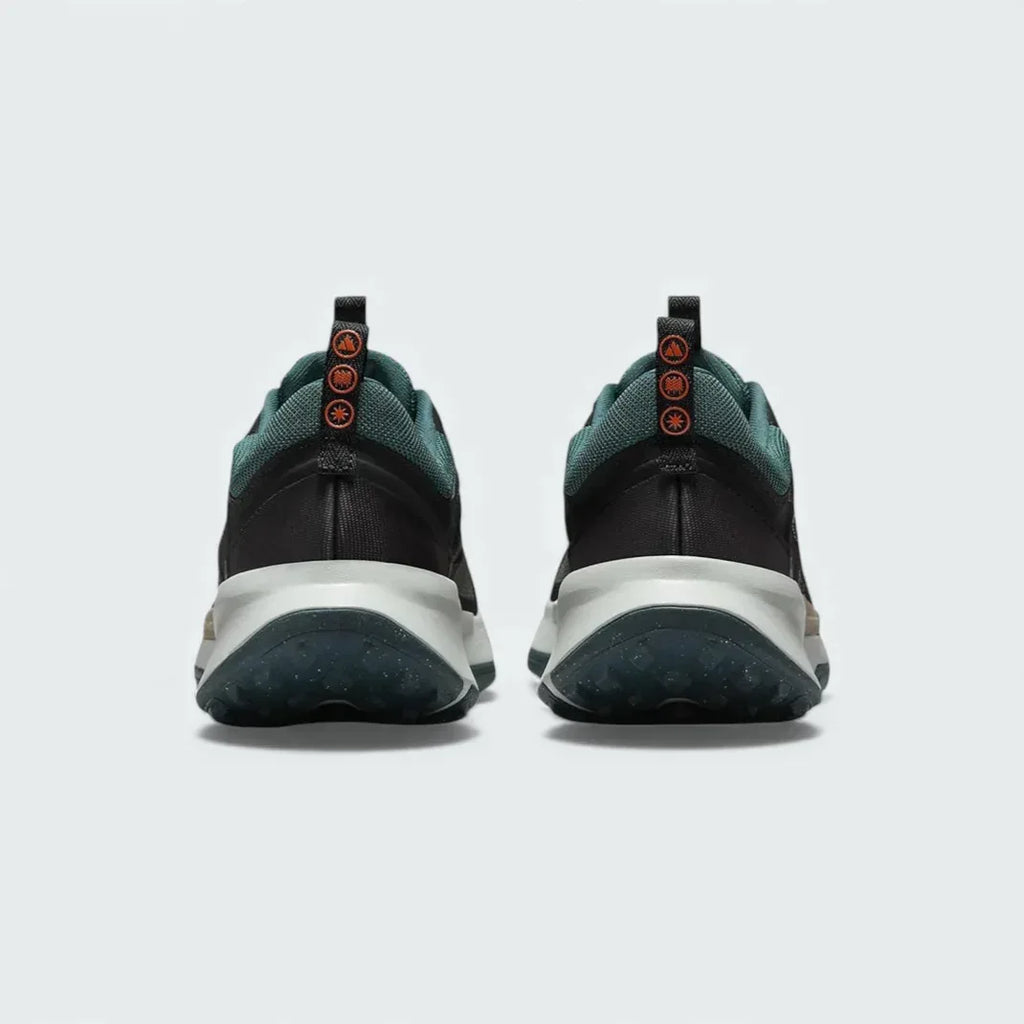 Rear view of the Nike Juniper Trail 2 Women's trail shoes, focusing on the structured heel and subtle branding.