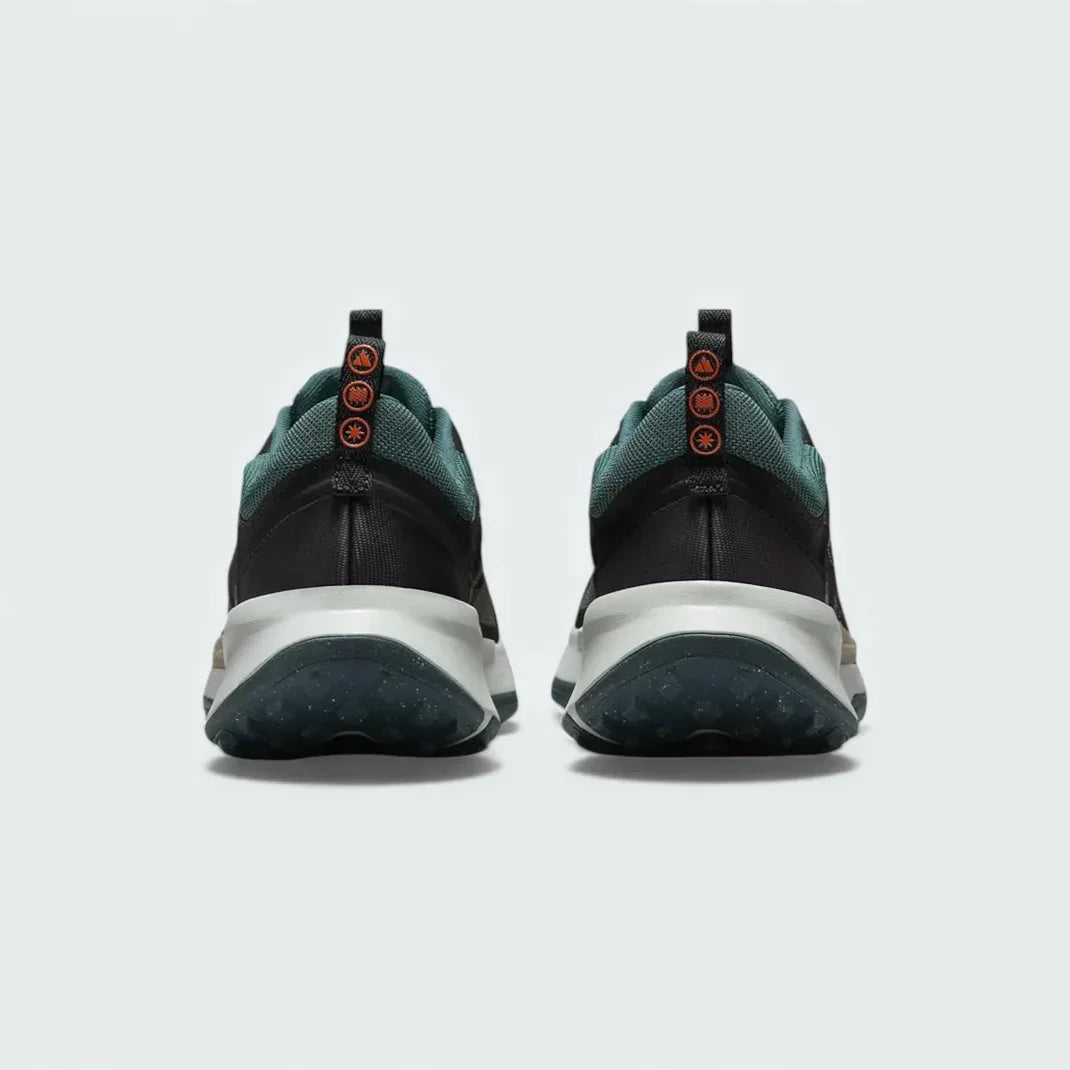 Rear view of the Nike Juniper Trail 2 Women's trail shoes, focusing on the structured heel and subtle branding.