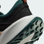 Detailed zoom on the outsole and midsole of the Nike Juniper Trail 2 Women's trail shoes, highlighting the cushioned foam and rugged rubber outsole.
