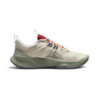 Highlights the inner profile displaying the Light Orewood Brown mesh body, tonal triangular Nike Trail mountain graphic, flecked midfoot Flywire loops, and sage green midsole carrier.