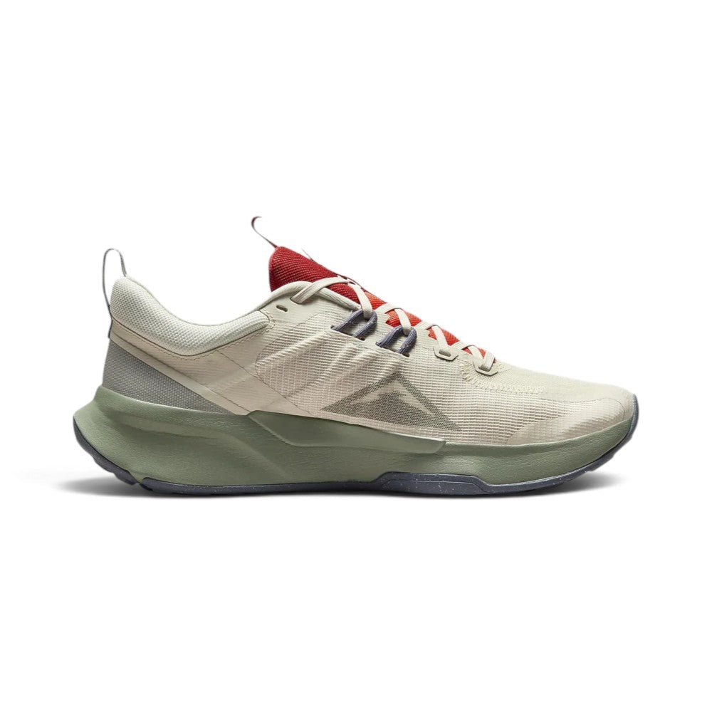 Highlights the inner profile displaying the Light Orewood Brown mesh body, tonal triangular Nike Trail mountain graphic, flecked midfoot Flywire loops, and sage green midsole carrier.