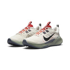 Emphasising the low-cut trail stance and the rich outdoor colour harmony between the earthy Light Orewood Brown uppers, bright red tongue accents, and sage green midsoles.