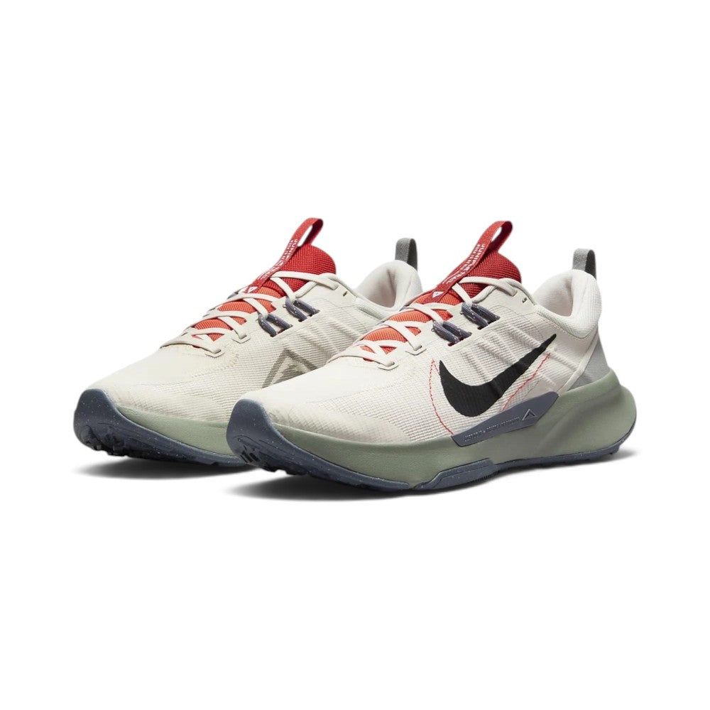 Emphasising the low-cut trail stance and the rich outdoor colour harmony between the earthy Light Orewood Brown uppers, bright red tongue accents, and sage green midsoles.