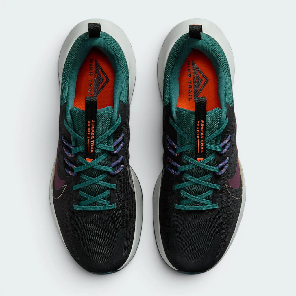 Focuses on the locked-in cable lacing system and the professional Nike branding on the tongue.