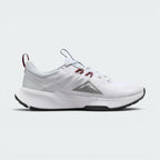 Highlights the inner profile showing the grey mountain peak logo, deep red lace loops, blue pull tab, and the smooth white foam midsole base.