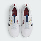Focuses on the locked-in central lacing layout, displaying the maroon insoles printed with lighthouse landmarks, blue tongue pull tabs, and alternating yellow and red lace eyelets.