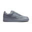 Displays the full lateral silhouette featuring the smooth cool grey and wolf grey leather upper, perforated toe box, tonal side Swoosh overlay, thick matching grey foam midsole with embossed "AIR" lettering, and durable rubber outsole.