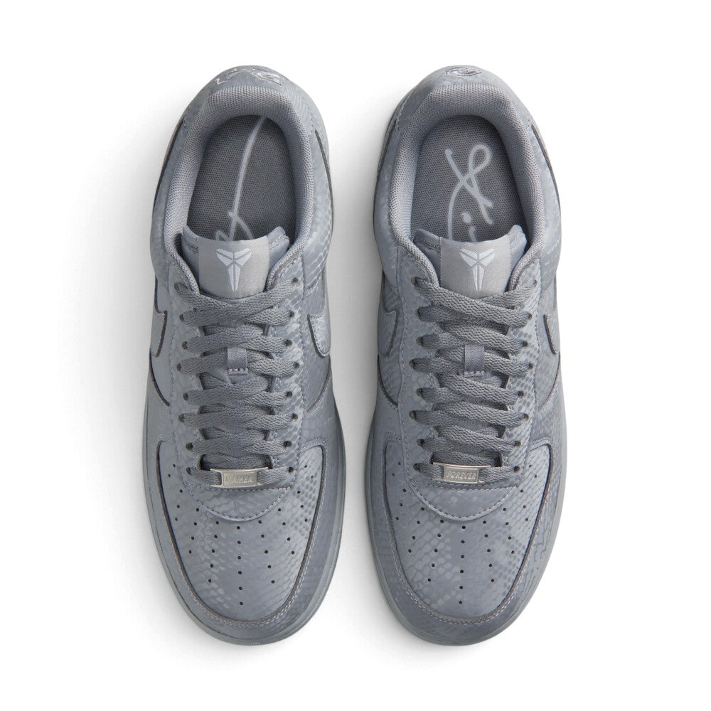 Direct overhead view of both shoes laid flat, showcasing the perforated forefoot panels, flat grey laces threaded through clean eyelets, branded tongues, and cushioned collar openings.