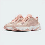 Emphasising the aggressive, chunky retro dad-shoe stance and the professional harmony of the monochromatic beige overlays against the wide, futuristic sole unit.