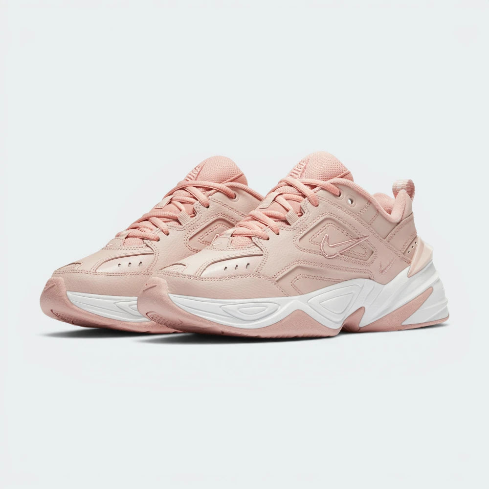 Emphasising the aggressive, chunky retro dad-shoe stance and the professional harmony of the monochromatic beige overlays against the wide, futuristic sole unit.