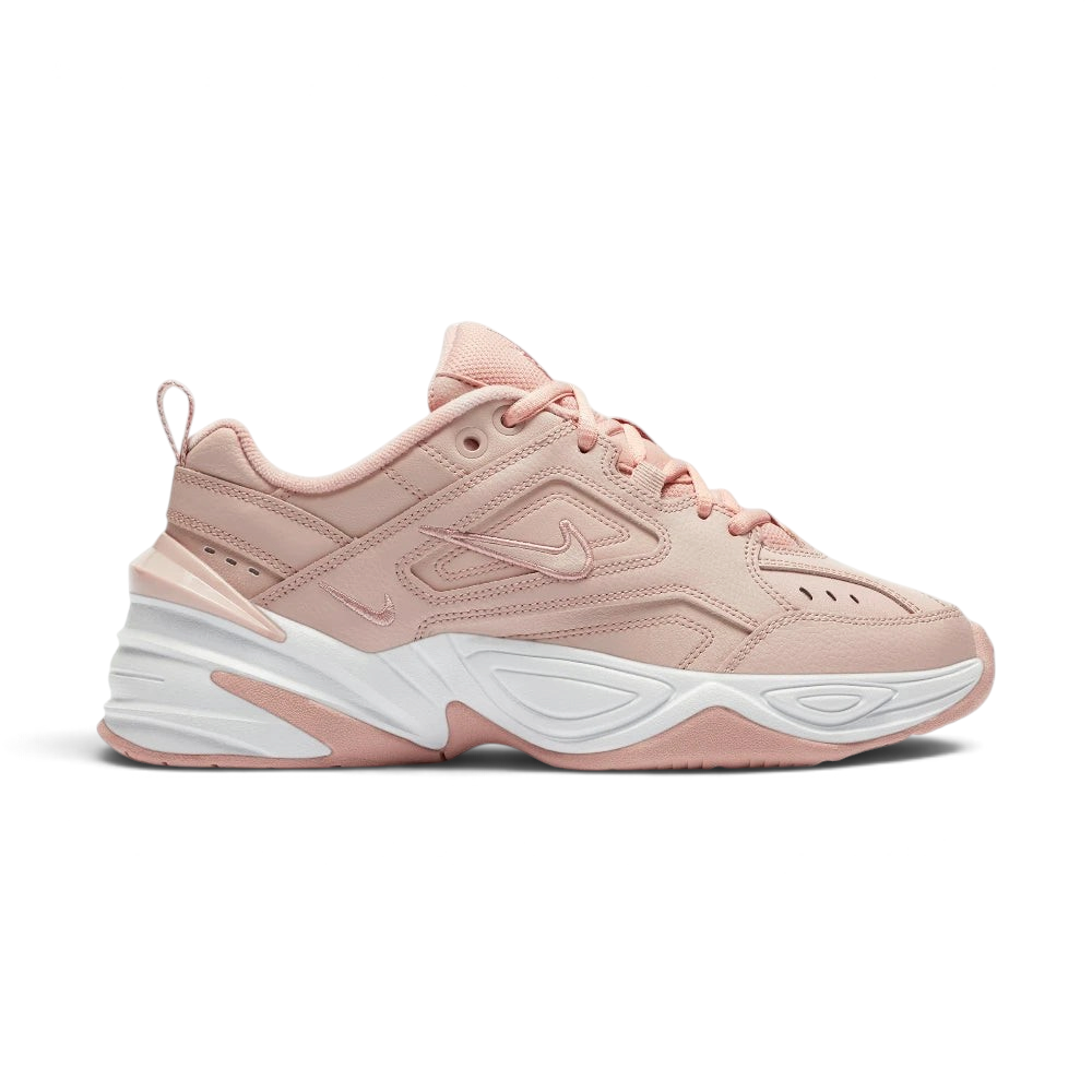 Highlights the high-velocity sweep of the clean tonal beige mini Nike Swoosh, showing the professional, multi-layered texture of the Particle Beige leather panels resting above the chunky, distorted lines of the thick beige foam midsole wall. Main image