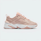 Highlights the high-velocity sweep of the clean tonal beige mini Nike Swoosh, showing the professional, multi-layered texture of the Particle Beige leather panels resting above the chunky, distorted lines of the thick beige foam midsole wall.