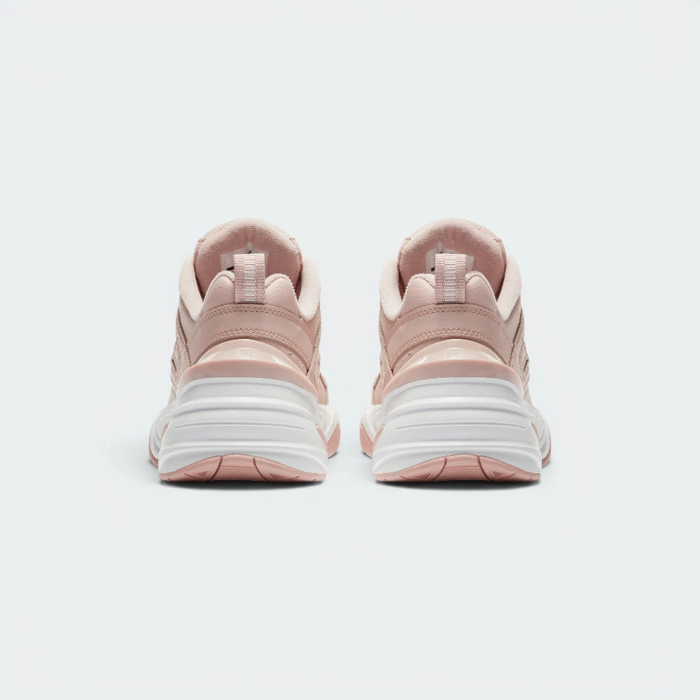 Focuses on the contoured shape of the padded collar, highlighting the sleek, distorted angles of the TPU heel clip sitting squarely below the webbed pull tab tracking down the rear spine.