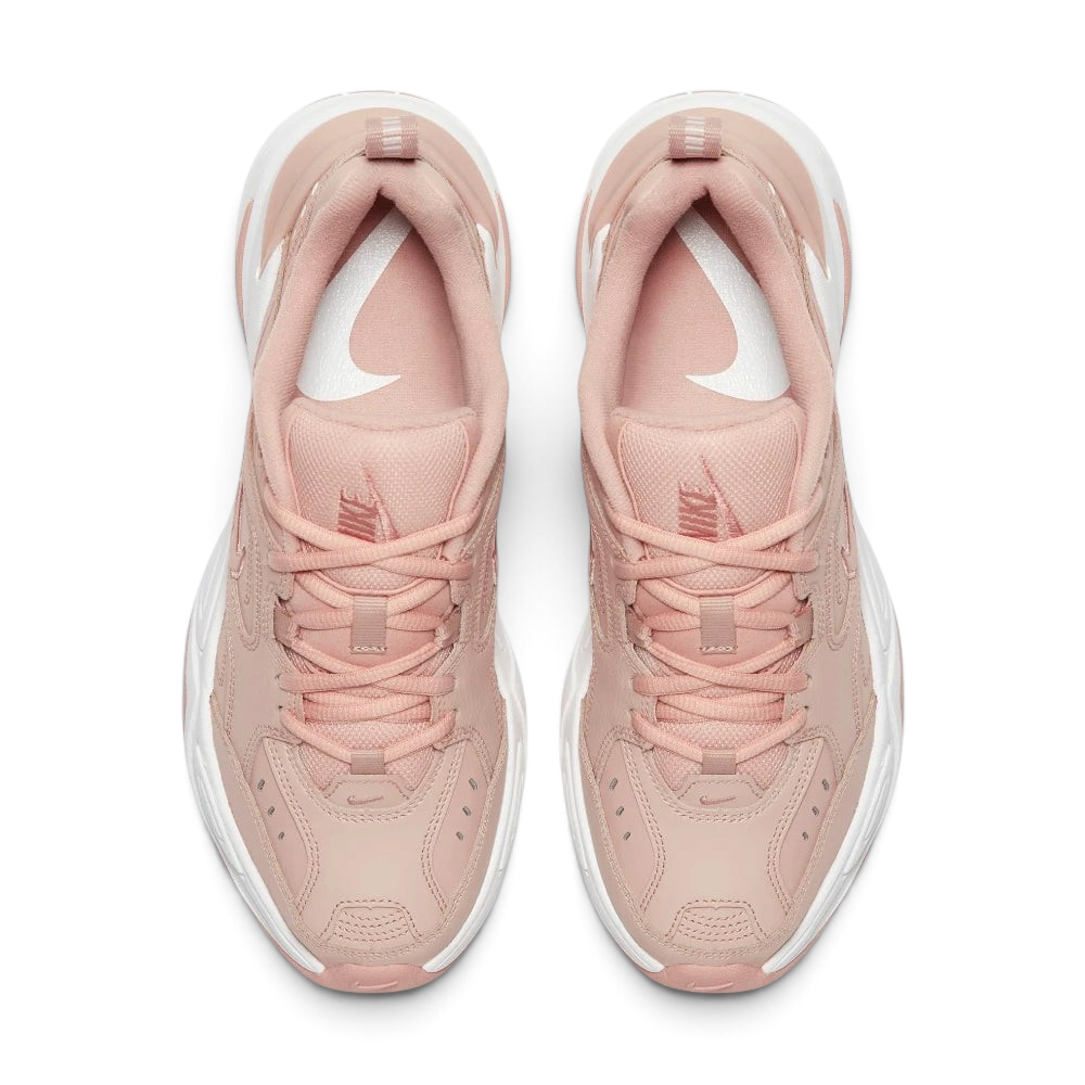 Focuses on the locked-in traditional lacing layout, displaying the perfect symmetry of the beige textile tongue, the debossed branding accents, and the clean stitching lines tracking down the leather front toe box area.