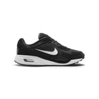 Displays the full lateral silhouette featuring the breathable black mesh upper, supportive synthetic leather mudguard overlays, the striking white side Swoosh, the thick white foam midsole, and the visible heel Air window.