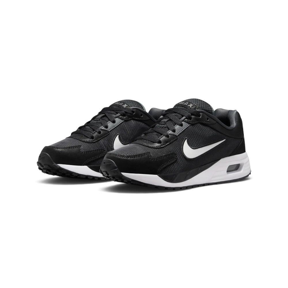 Forward three-quarter angle showcasing both shoes side by side, highlighting the streamlined running stance, tonal black-and-anthracite upper texture, and clean white midsole contrast.