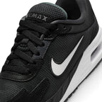 Macro focus on the forefoot and eyestay, detailing the fine mesh texture, synthetic overlay stitching lines, and the padded Air Max tongue label.