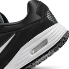 Macro view of the lateral heel transition, highlighting the clean cellular structure of the visible Max Air window and the durable rubber tread grip wrap.