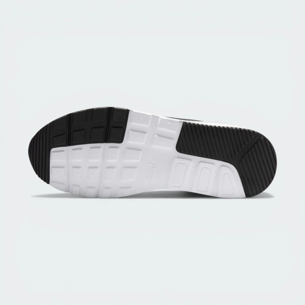 Outsole View: Showing the rubber traction pattern and the integrated flex grooves for natural movement.