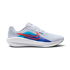 Highlights the high-velocity sweep of the Blue Lightning Nike Swoosh, showing the professional, texturized weave of the Football Grey mesh upper resting above the thick, angular soft white foam midsole wall with pops of Bright Crimson.