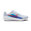 Highlights the high-velocity sweep of the Blue Lightning Nike Swoosh, showing the professional, texturized weave of the Football Grey mesh upper resting above the thick, angular soft white foam midsole wall with pops of Bright Crimson.