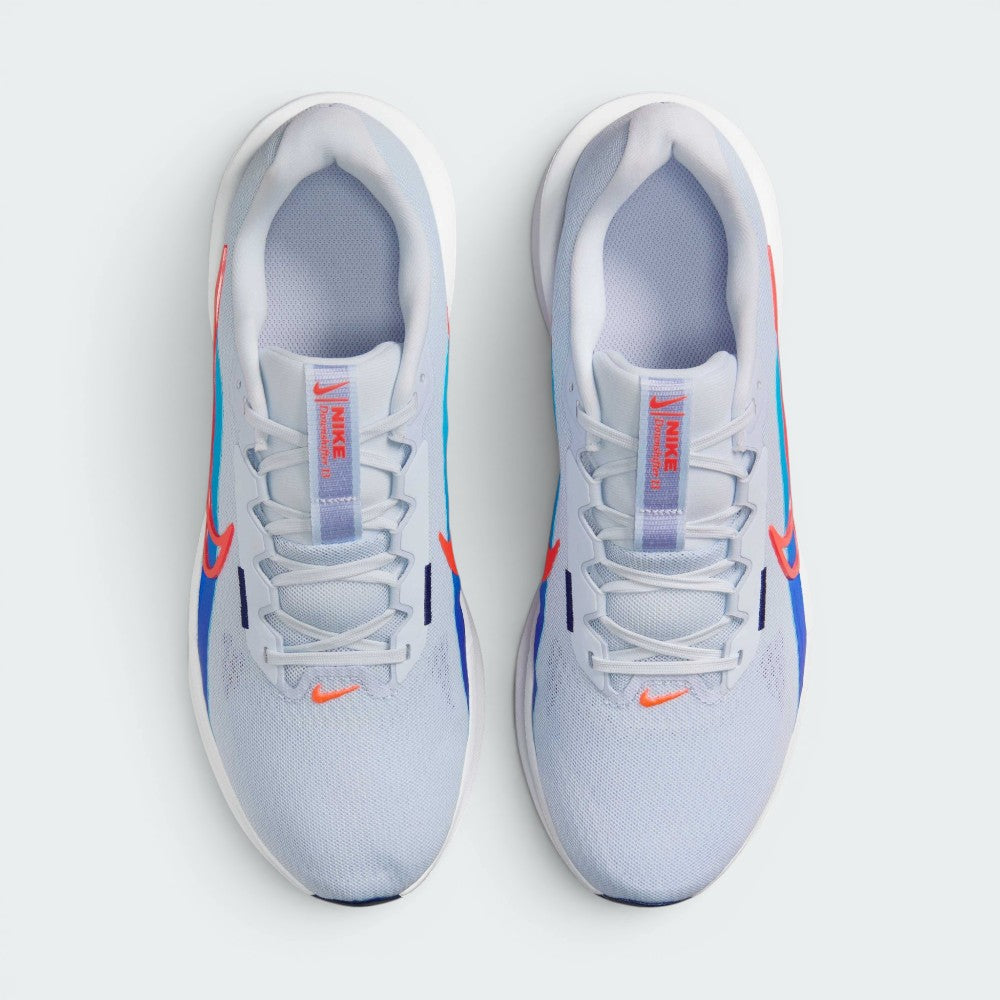 Focuses on the locked-in traditional lacing layout, displaying the perfect symmetry of the Deep Night textile tongue, the branded logo label, and the breathable mesh guarding the front toe box area.