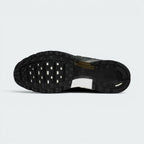 Displays the full-length black rubber sole, showcasing the classic waffle tread pattern interlocked with a central stability shank and white midfoot accent insert.