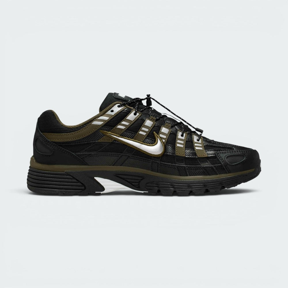 Highlights the inner profile displaying the matching Cargo Khaki overlay grid pattern, metallic silver Swoosh, speed lacing cord tracking, and structured dark heel counter.