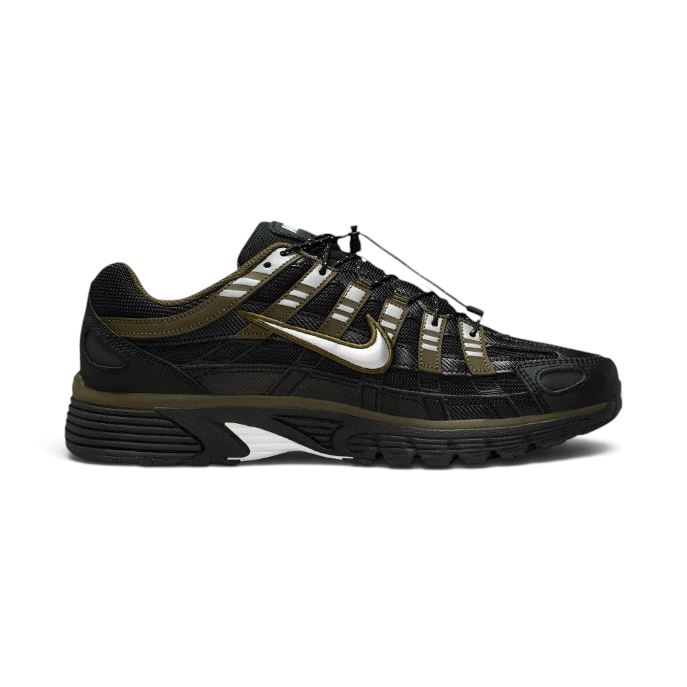 Highlights the inner profile displaying the matching Cargo Khaki overlay grid pattern, metallic silver Swoosh, speed lacing cord tracking, and structured dark heel counter.