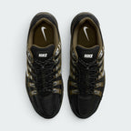 Focuses on the locked-in toggle lacing layout, displaying the flecked speed laces with cinch lock, central "BOWERMAN SERIES" ribbon, black mesh tongues, and khaki-lined interior footbeds with white Swoosh logos.