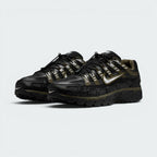 Emphasising the low-cut, aggressive three-quarter techwear stance of the trainers and the stealthy contrast between the black mesh uppers and Cargo Khaki structural cage overlays.