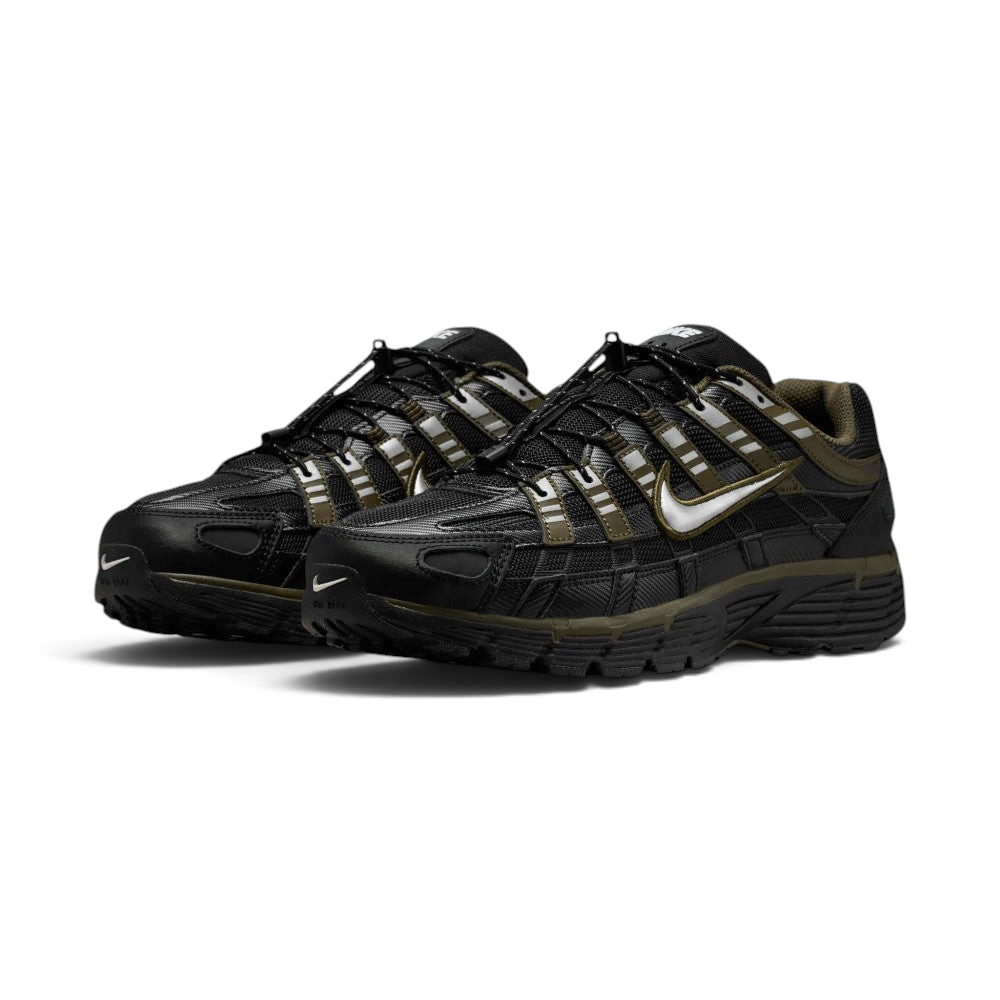 Emphasising the low-cut, aggressive three-quarter techwear stance of the trainers and the stealthy contrast between the black mesh uppers and Cargo Khaki structural cage overlays.