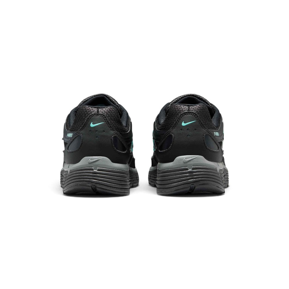 Showing the structured rear heel counter, detailing the layered metallic cool grey leather heel wrap, hyper turquoise mini Swoosh embroidery, padded Achilles collar, and sculpted foam heel bevel.