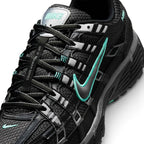 Focusing on the Breathable Open-Pore Black Mesh Toe Box, Metallic Cool Grey Cage Overlays, and Branded Tongue Webbing, demonstrating the upper airflow channels, structural containment boundaries, and refined finish as the stylish final detail.