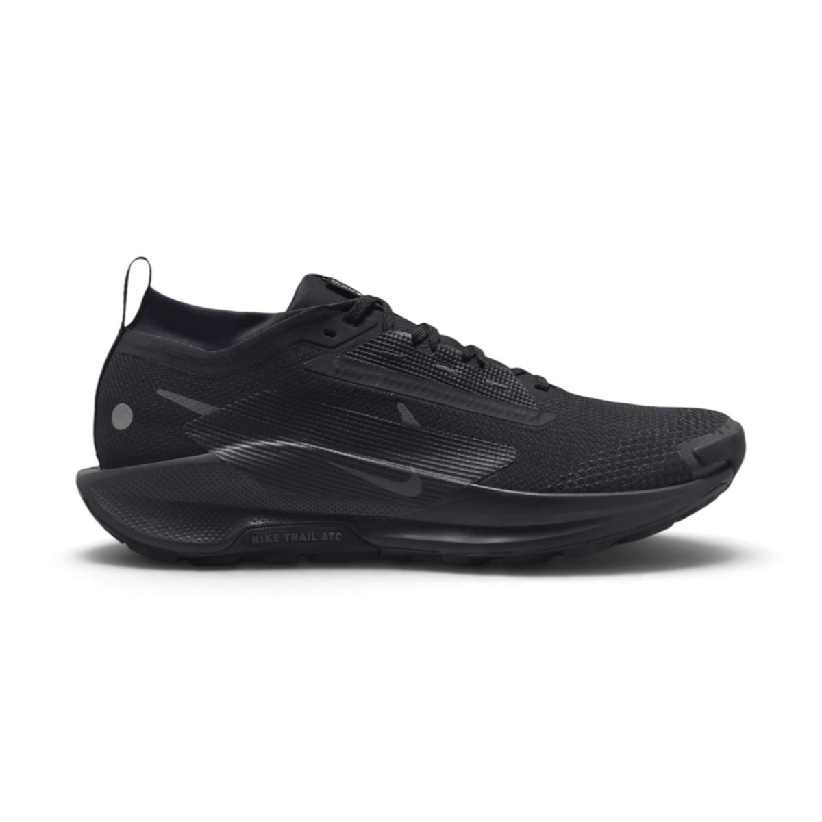 Displays the full lateral silhouette featuring the stealthy Black waterproof GORE-TEX upper, the tonal side Swoosh, the thick ReactX foam midsole stamped with "NIKE TRAIL ATC", and the rugged all-terrain outsole. Main image