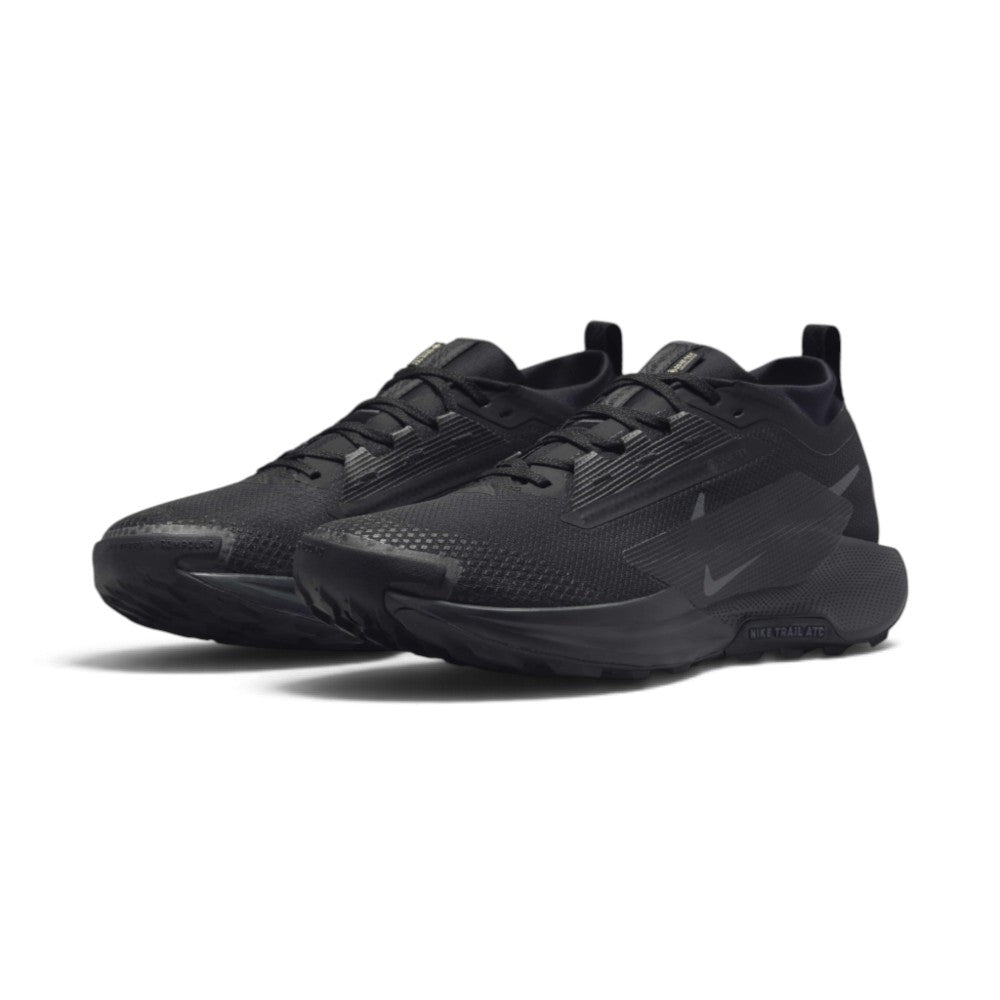 Forward three-quarter angle showcasing both shoes side by side, highlighting the rugged off-road stance, weather-resistant mesh texture, and clean all-black utilitarian design.