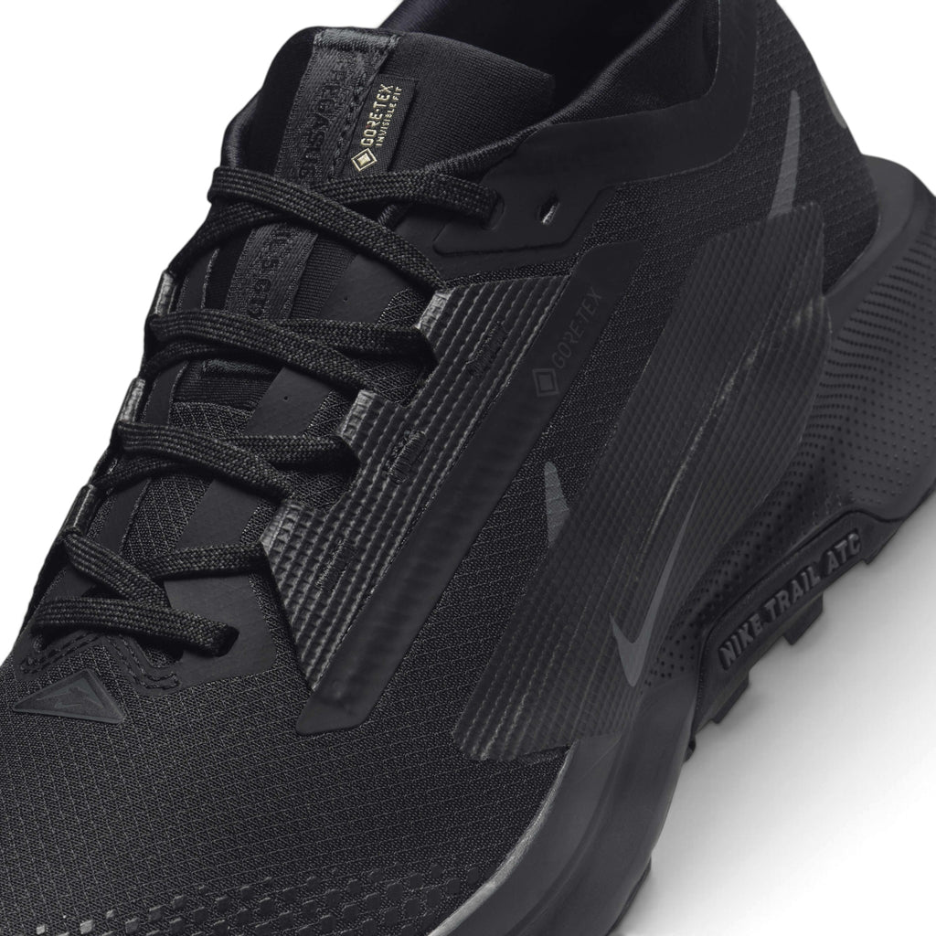 Macro focus on the forefoot and eyestay zone, detailing the fine GORE-TEX Invisible Fit mesh weave, water-repellent coating, and secure lace anchor loops.