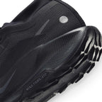 Macro view of the lateral heel transition, highlighting the textured ReactX foam sidewall wrap, reflective heel dot, and the aggressive profile of the all-terrain traction lug