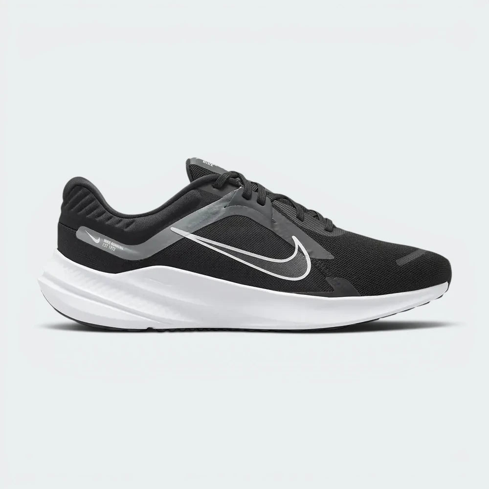 Highlights the high-velocity white Nike Swoosh slashing across the professional depth of the black engineered mesh upper and the contoured midsole wall. Main image