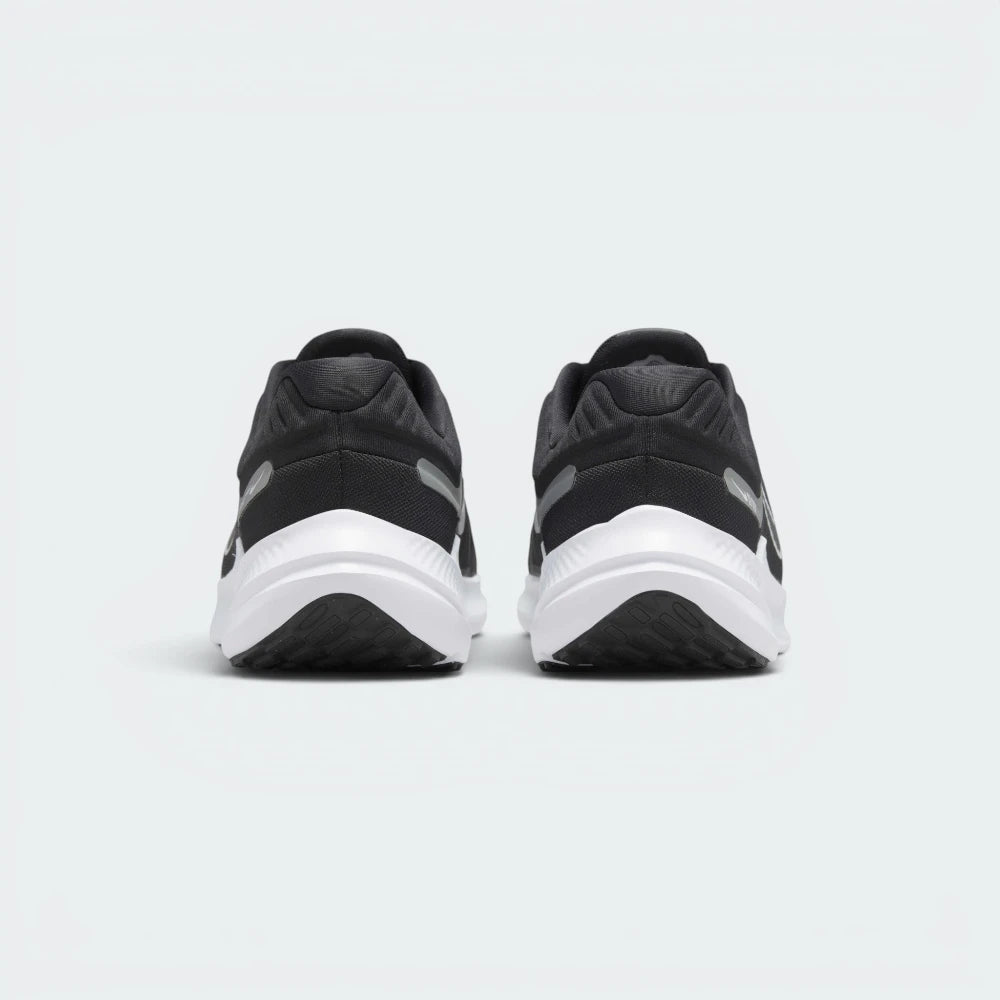 Focuses on the structured heel counter architecture and the clean finish of the raised, shock-absorbing midsole foam.