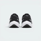 Focuses on the structured heel counter architecture and the clean finish of the raised, shock-absorbing midsole foam.