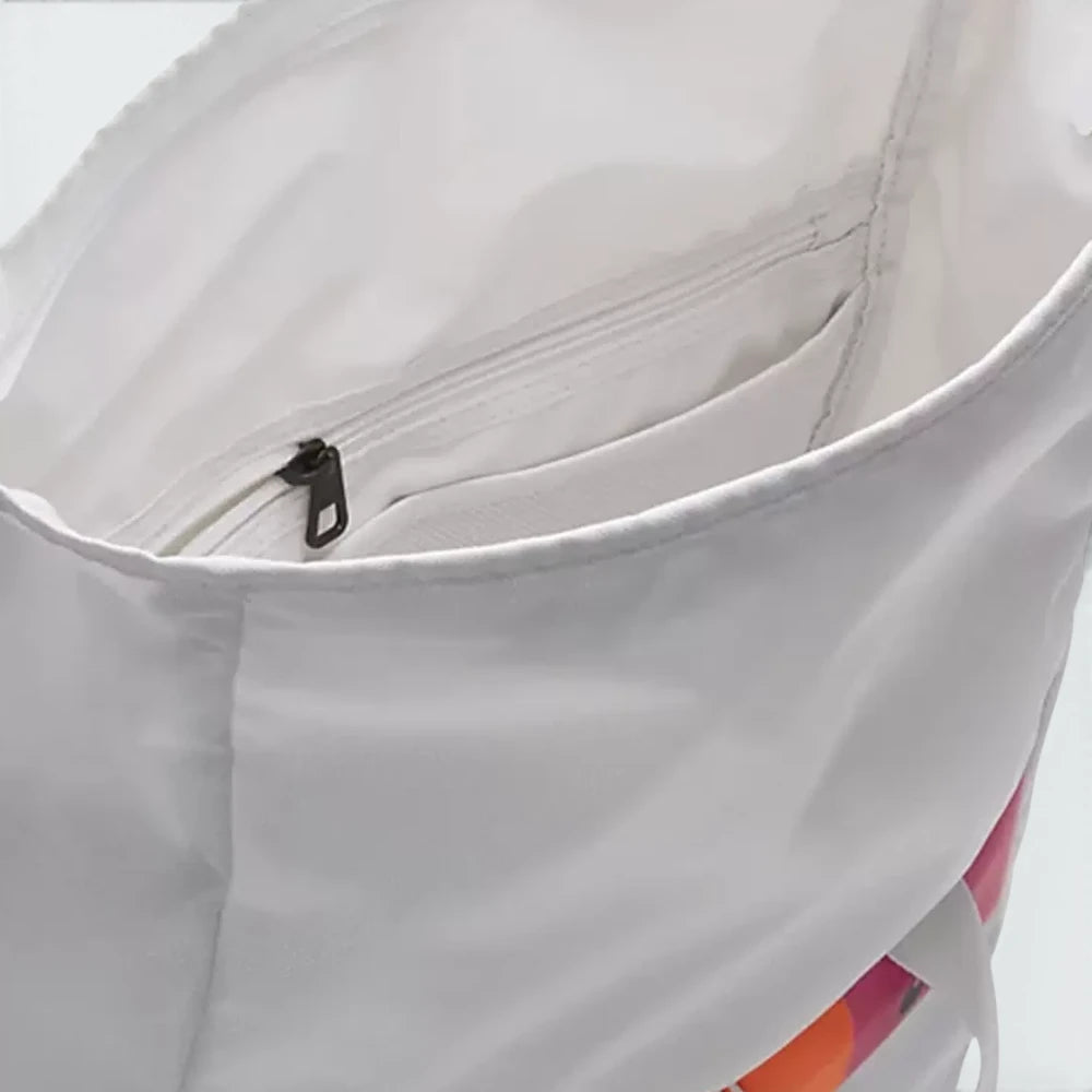Focuses on the contoured shape of the back panel, highlighting the clean, ventilated mesh lining running along the adjustable shoulder straps, engineered to cradle your back with elite comfort.