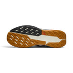 Displays the full-length Nike Trail ATC rubber outsole, showcasing the multi-directional hybrid lug pattern, wet-weather siping, decoupled flex grooves, and the central Nike Trail logo badge.