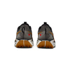 Focuses on the rear profile, displaying the structured heel counter, convenient webbing pull tab, and the wide flared footprint of the ReactX foam midsole base.