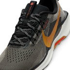 Details the micro-precision of the forefoot area, showing the open-hole mesh toe box, bonded protective synthetic toe cap, flat laces, and integrated Flywire cable eyelets.