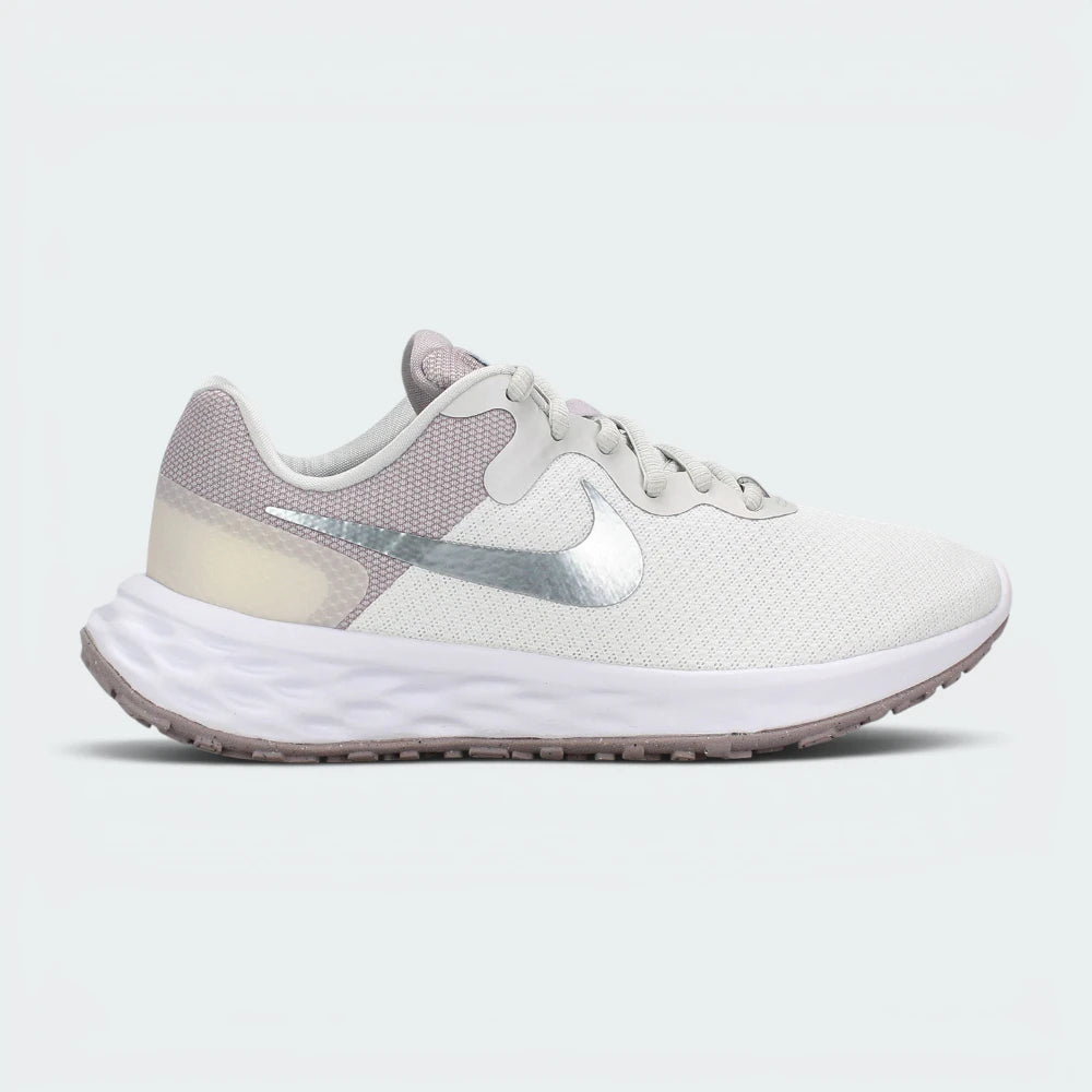 Highlights the high-velocity sweep of the metallic silver Nike Swoosh, showing the professional texture of the white mesh forefoot, the muted Ocean Cube blue-grey heel paneling, and the clean white foam midsole wall.