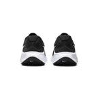 Focuses on the rear profile, displaying the visible external Achilles heel puffs, supportive heel counter construction, and the wide flared base of the white foam midsole.