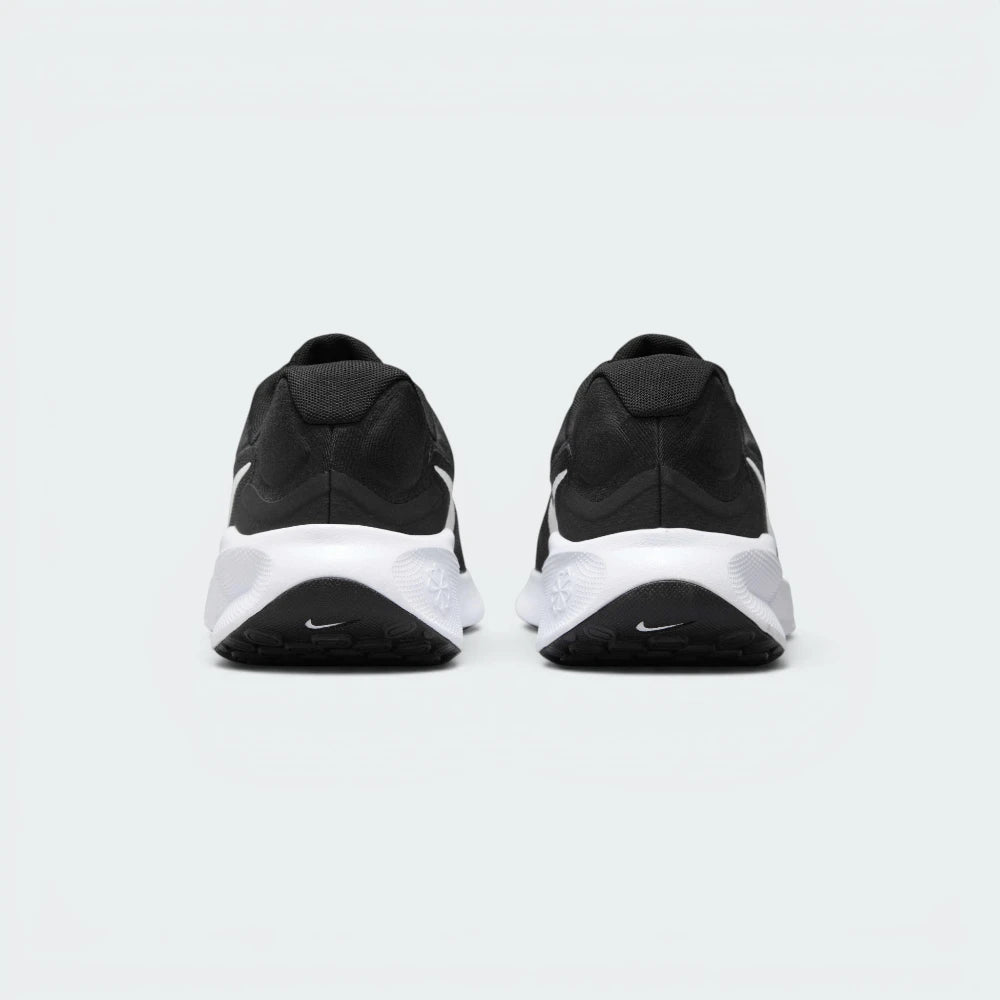 Focuses on the contoured shape of the padded ankle collar, highlighting the soft, pillowy Achilles puffs visible on the outer heel counter.